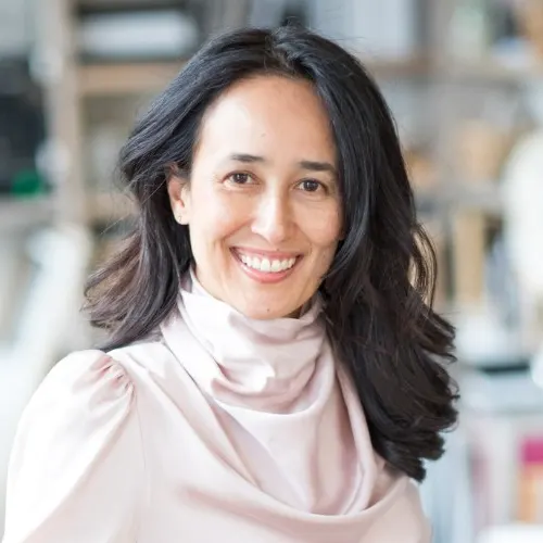 Clean and clear image of Mariam Naficy with soft lighting and studio background, suitable for executive profile features.