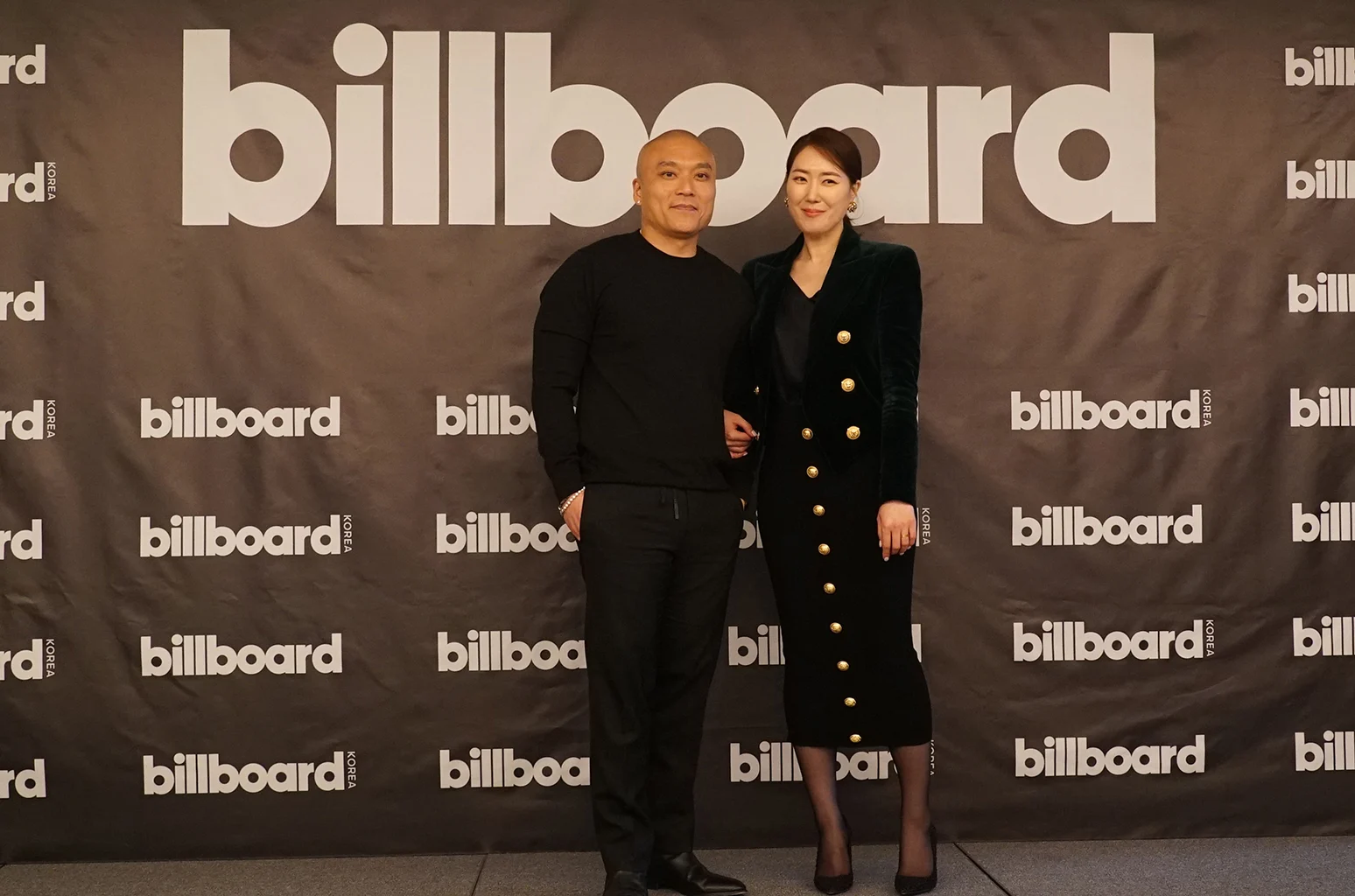 High-resolution event image featuring Mike Van and Yuna Kim from a Billboard launch, conveying international expansion theme.