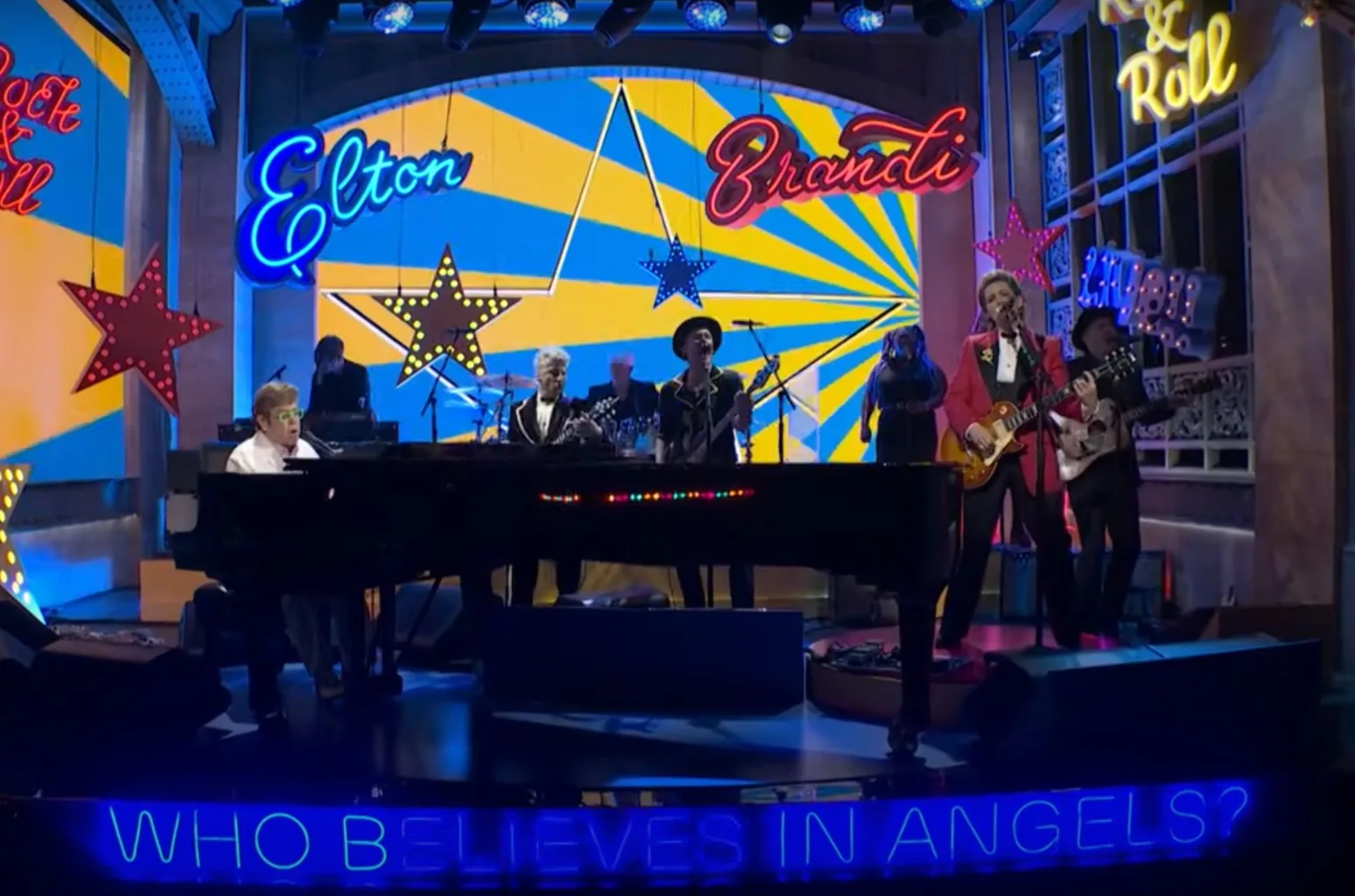 Brandi Carlile and Elton John backstage at SNL during the 2025 episode featuring their live duet.