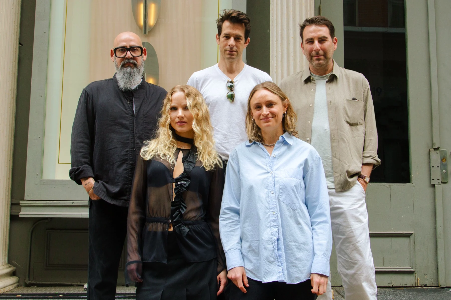 Mark Ronson pictured with Pulse Music Group executives in a high-quality promotional photo for their publishing partnership.