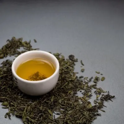 Artistic image of bowls filled with green tea, offering a modern and minimalist visual that aligns with health and lifestyle themes.