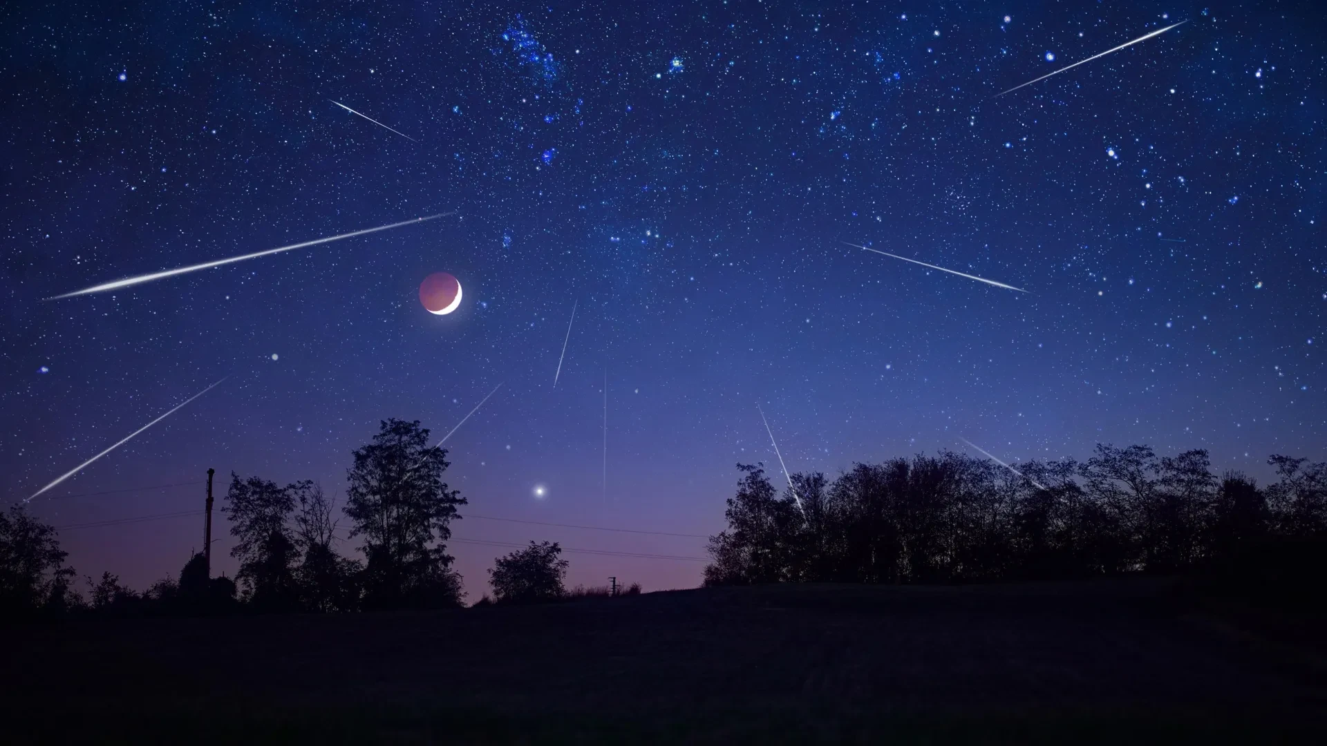 High-quality image showing the full moon illuminating a starry sky with meteors visible in the background, representing a supermoon-meteor shower combination.