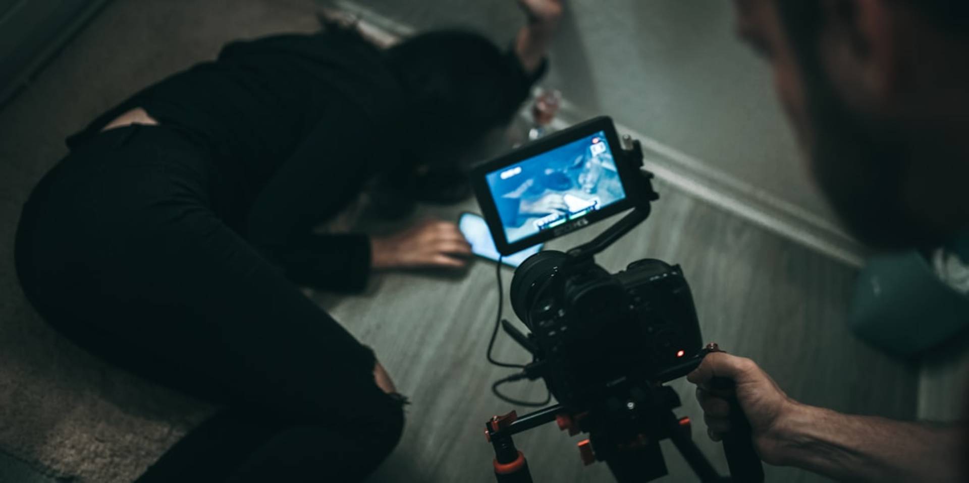 Content creator at desk with organized inspiration video system