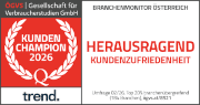 ALT-Tag: Logo der Auszeichnung "Kunden Champion 2026" der ÖGVS (Gesellschaft für Verbraucherstudien GmbH). Links ein roter Lorbeerkranz, darunter der Schriftzug "trend.". Rechts der Text "Branchensmonitor Österreich - Herausragend Kundenzufriedenheit", zusammen mit dem Umfragevermerk.