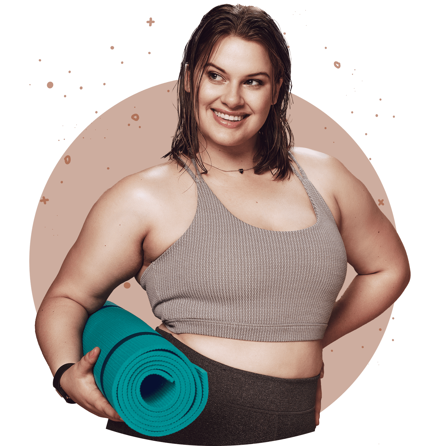 Woman smilling and holding a yoga mat 