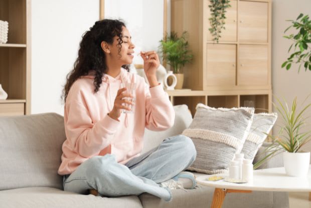 A comfortable woman taking medication