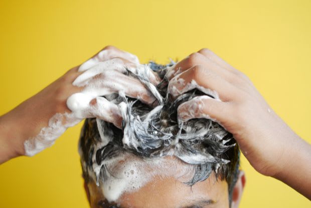 a man shampooing his hair