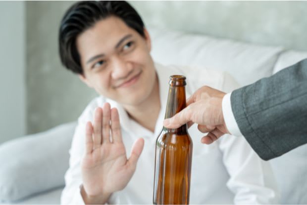 a man refusing alcohol