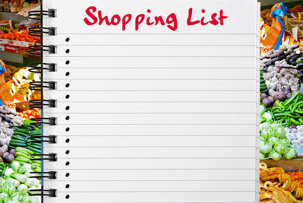 A graphic of a shopping list surrounded by healthy foods. 