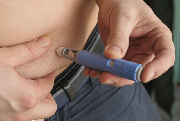 an overweight man injecting Ozempic into his abdomen