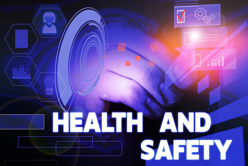 A graphic of “Health and Safety” wording with translucent hands and icons