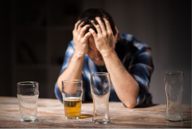 a man struggling with alcohol use disorder