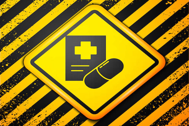 A graphic of a yellow and black diamond-shaped warning sign with a pill and prescription pad. 
