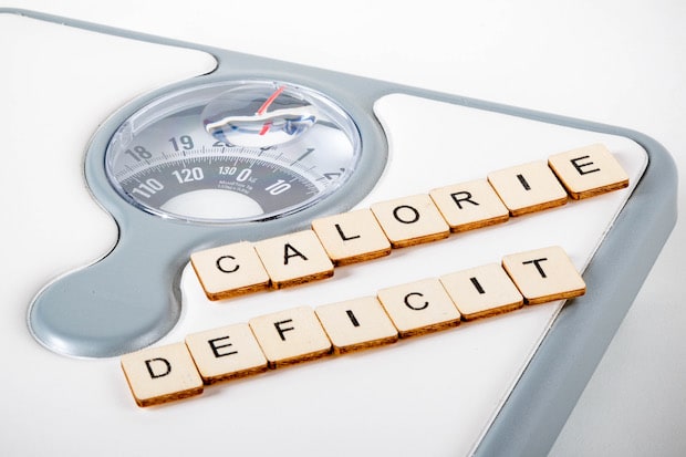 scrabble letters spelling "calorie deficit"
