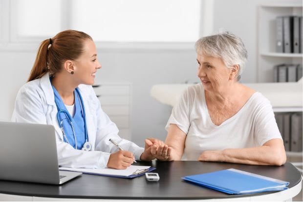 elderly woman consulting a doctor