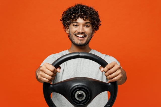Person with steering wheel