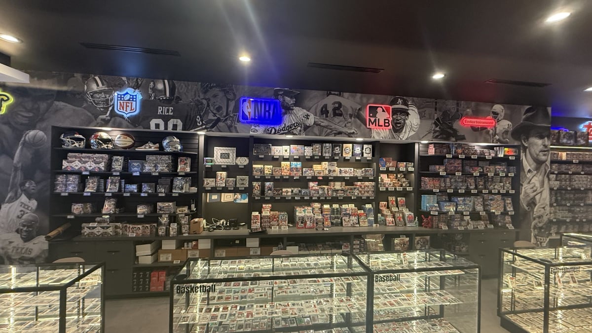 The NFL, NBA and MLB wax wall and singles cases at Mo Bamba Cards & Collectibles
