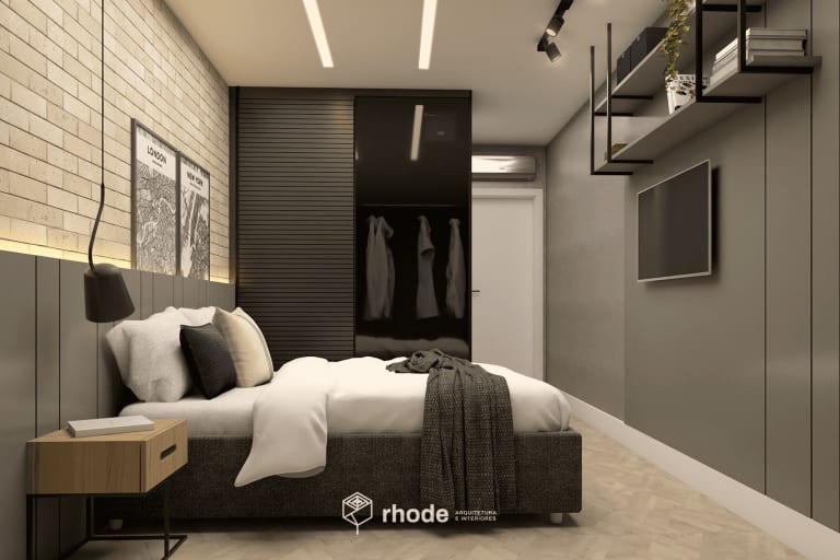 quarto de casal com estilo industrial. O rústico da parede de tijolinhos atrás da cama contrasta com as cores monocromáticas do restante do ambiente.