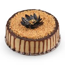 Butterscotch cake topping with chocolate cream and nuts