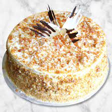 Butterscotch cake garnished with Nuts