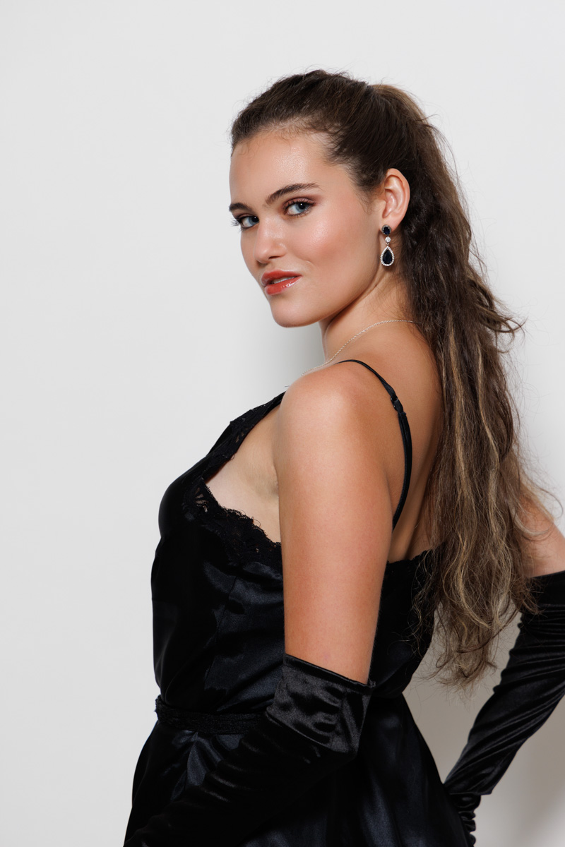 Glamour portrait with statement jewelry detail