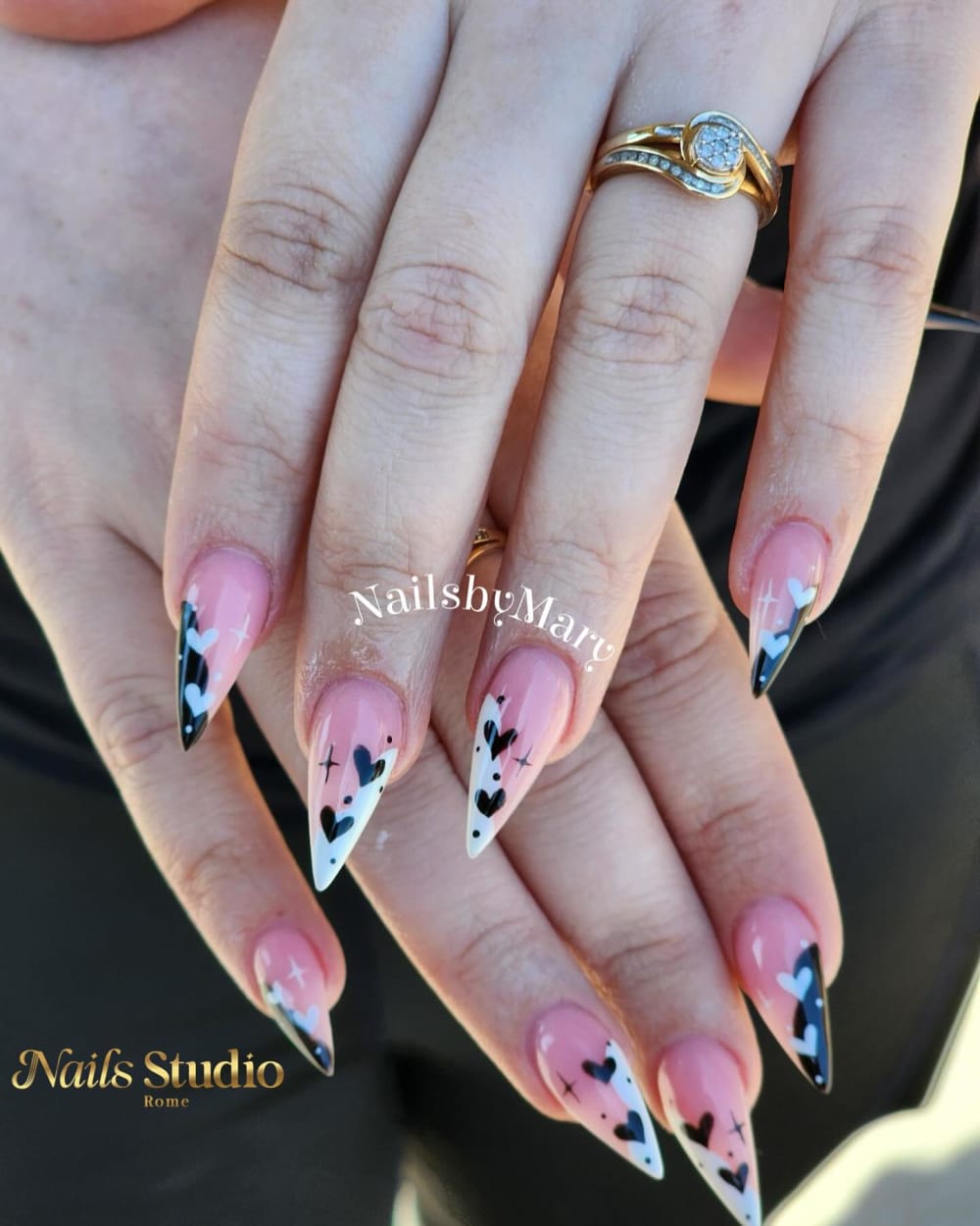 black and white french and nail art nails, stiletto shape — nail salon in Calhoun, GA — Sonny & Tee