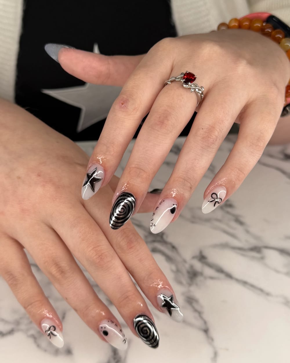 white and black nail art nails, almond shape — nail salon in Calhoun, GA — Sonny & Tee