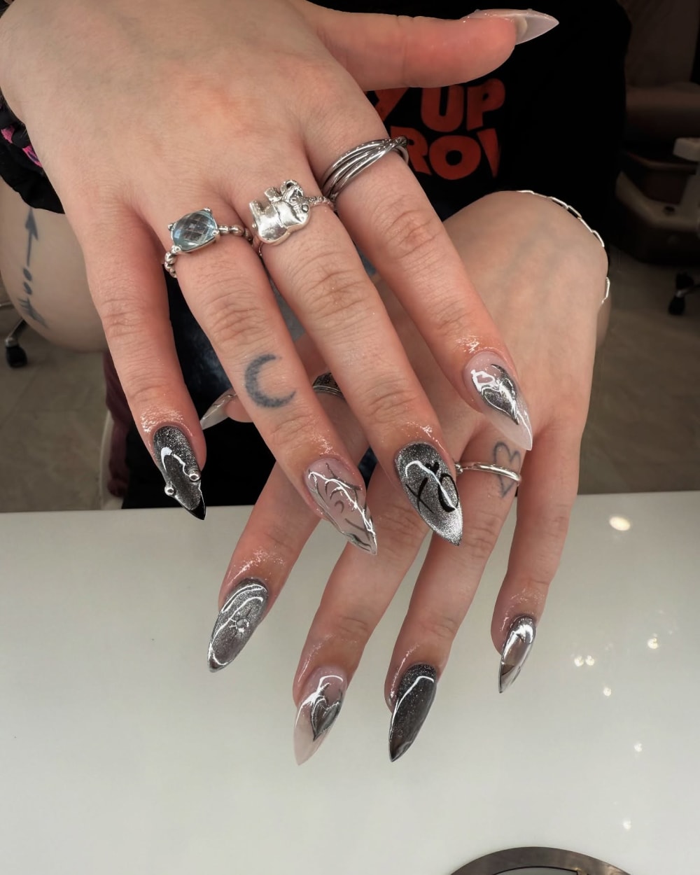 chrome and black chrome and nail art nails, stiletto shape — nail salon in Calhoun, GA — Sonny & Tee