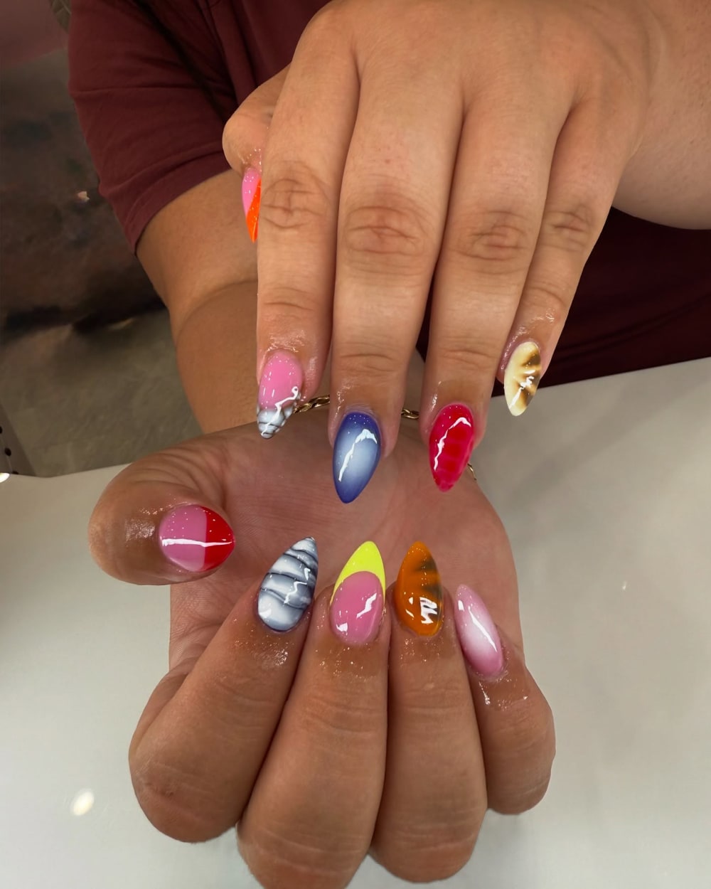 pink and blue nail art nails, almond shape — nail salon in Calhoun, GA — Sonny & Tee