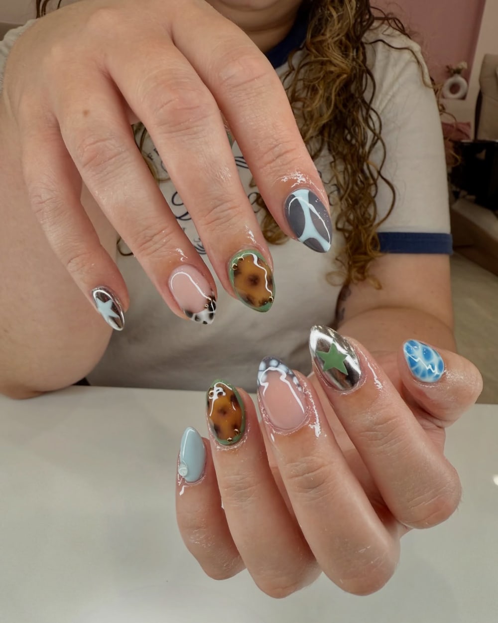 blue and white nail art and chrome nails, almond shape — nail salon in Calhoun, GA — Sonny & Tee