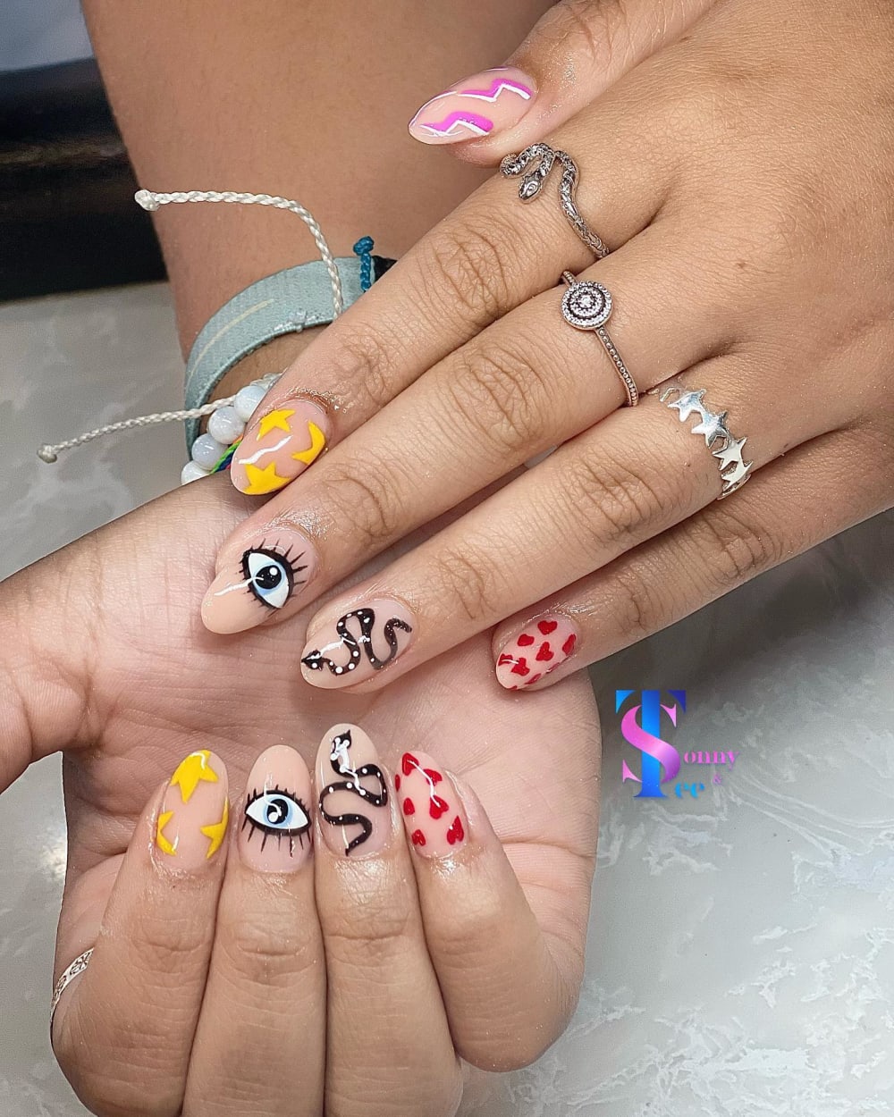 nude and black nail art nails, oval shape — nail salon in Rome, GA — Sonny & Tee