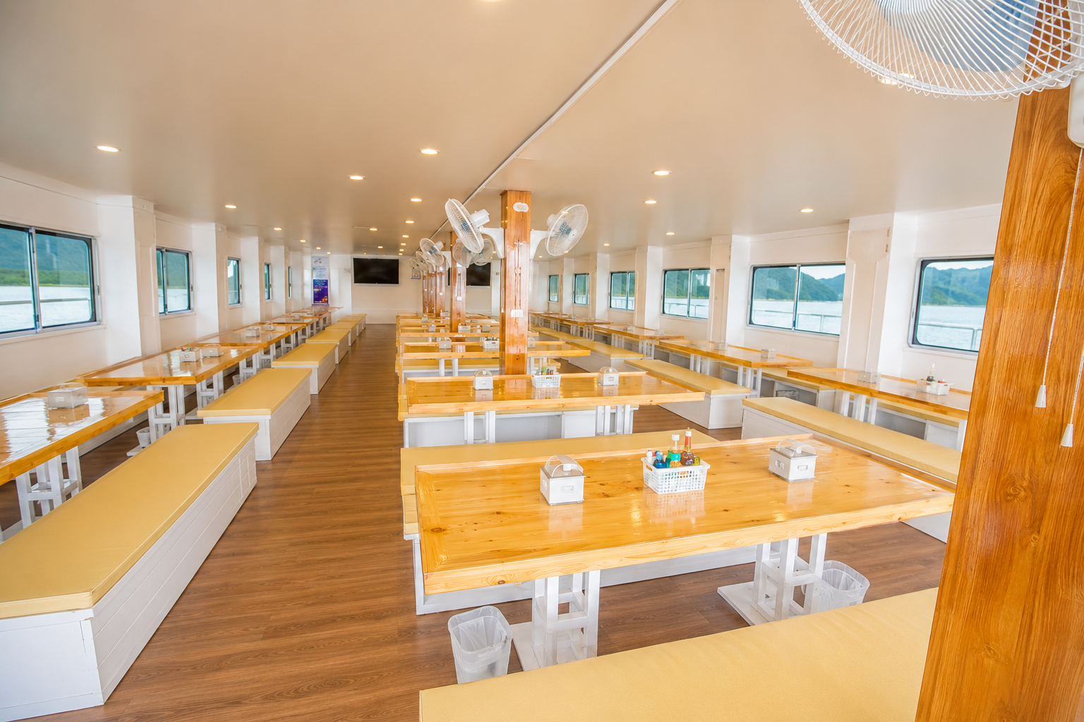 Spacious dive deck with tank racks and gear benches