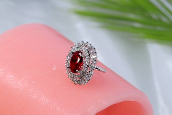 Oval Ruby Red Stone Designer Ring with CZ Sunburst Halo & Silver Polish
