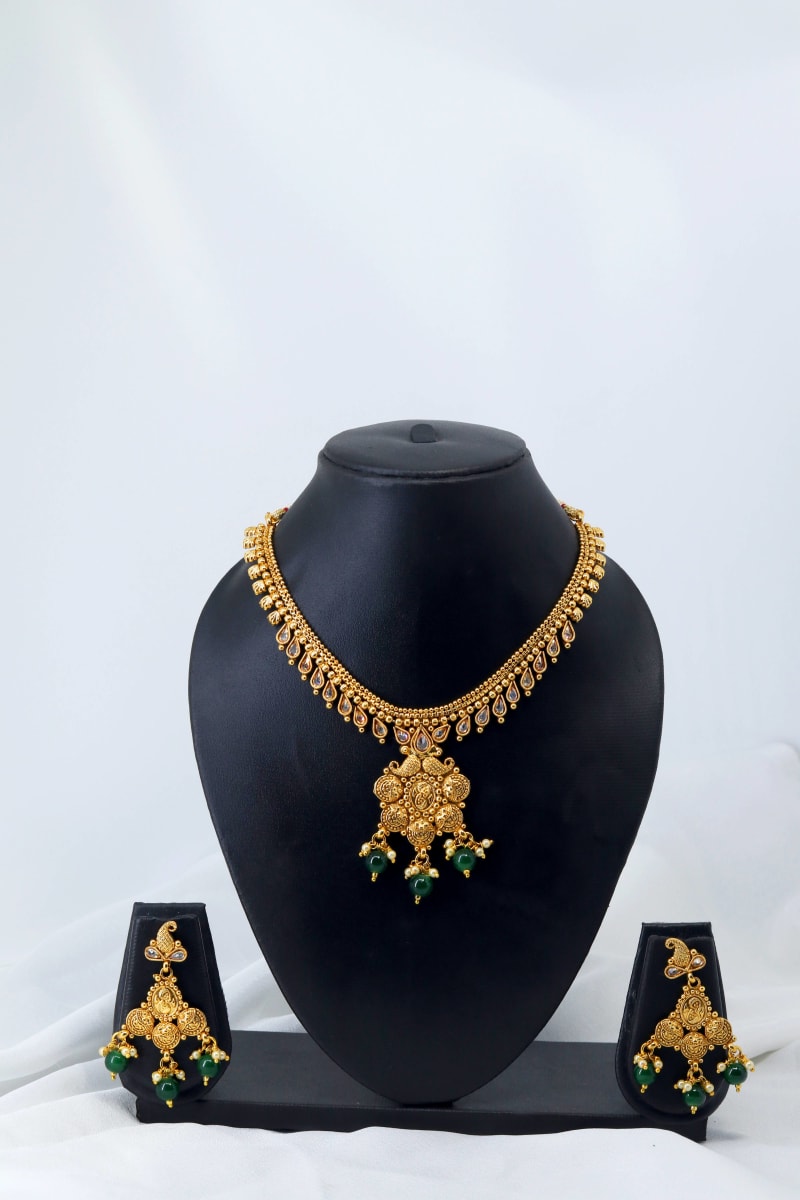 Gold-Plated Traditional Necklace Set with Kundan Stones & Green Bead Drops