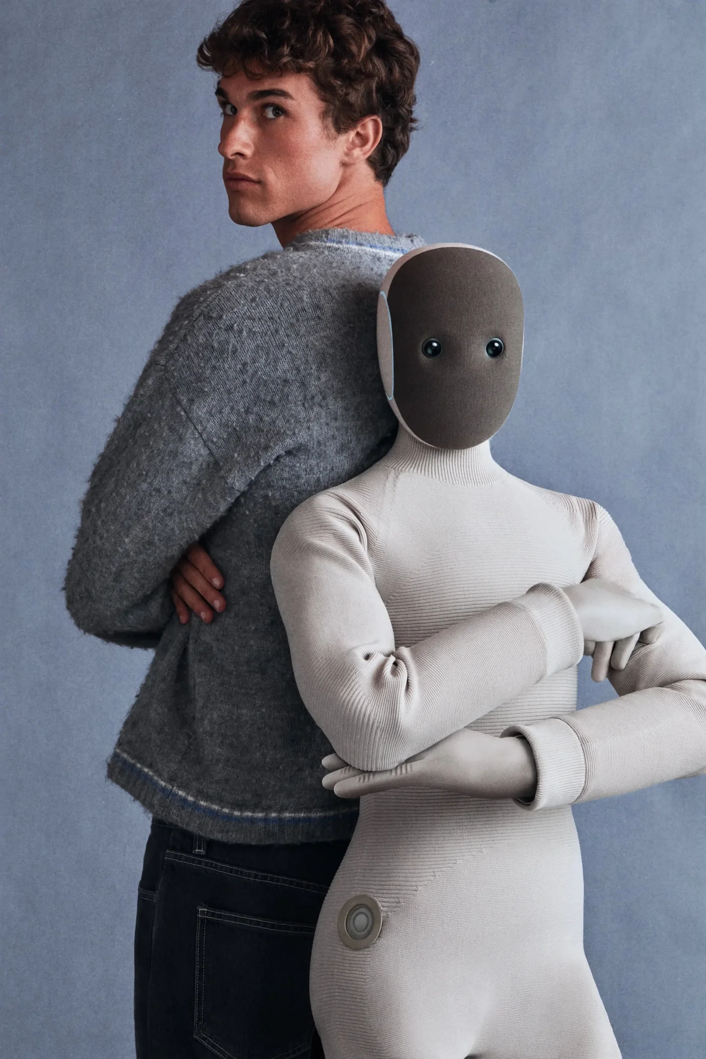 1X NEO humanoid robot for elderly care, assisting a senior person at home