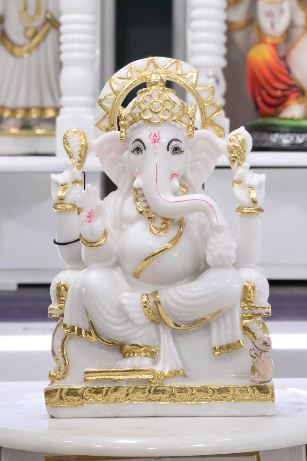 Marble murti with the face and the folds of the robe carved by hand