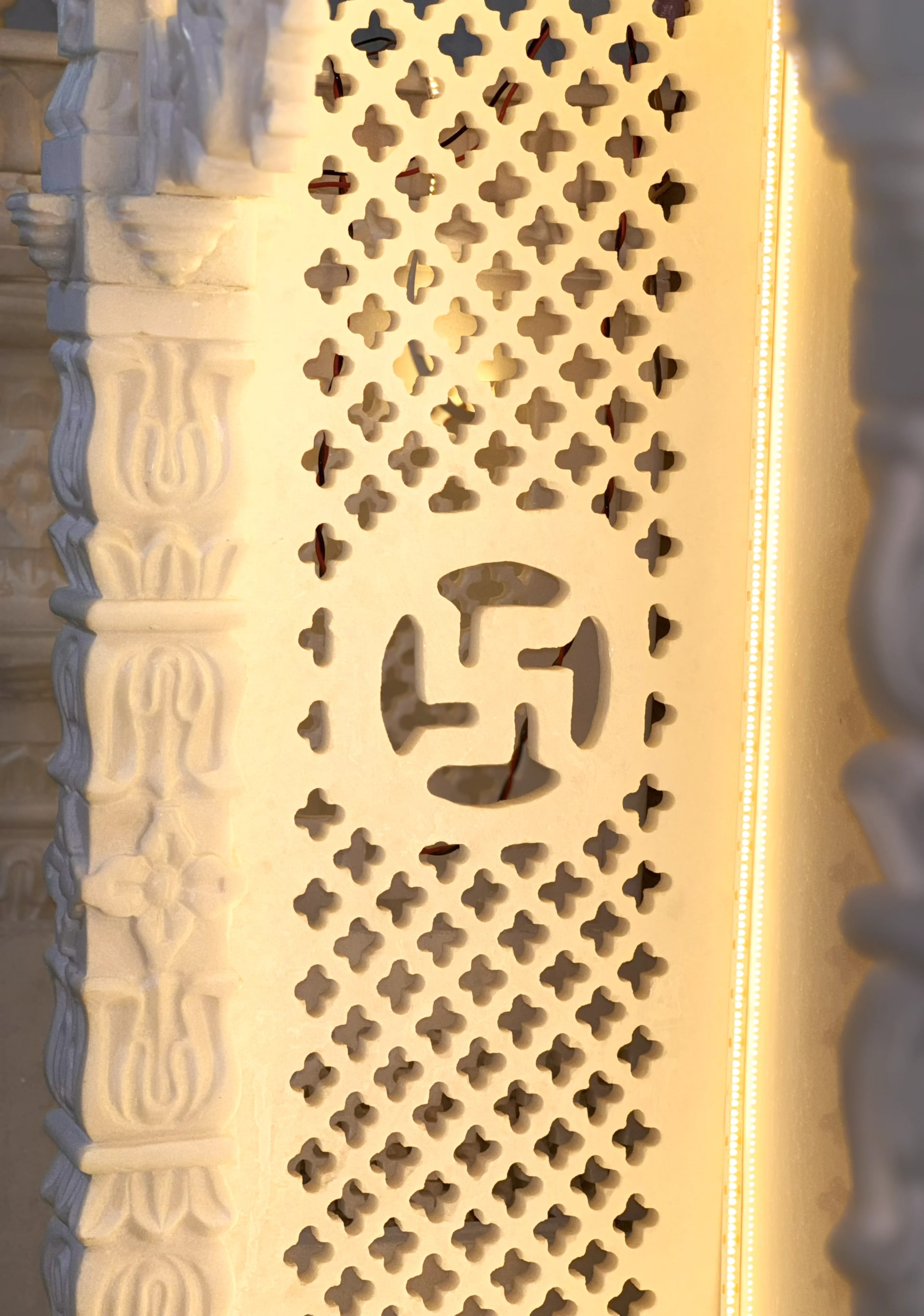 Turned marble railing pillar, polished smooth, with a carved capital