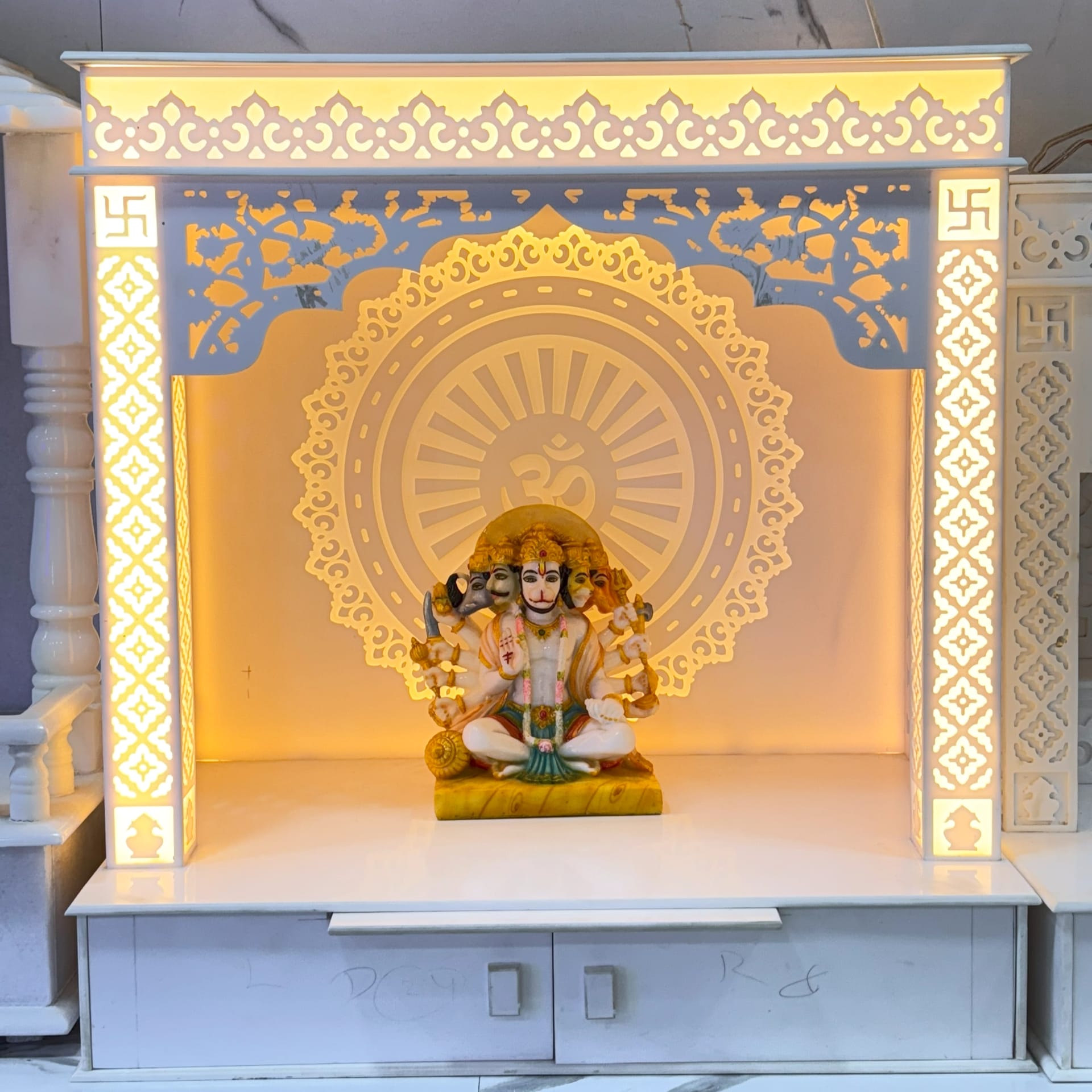 Plain modern Corian mandir in white, straight edges and no carving