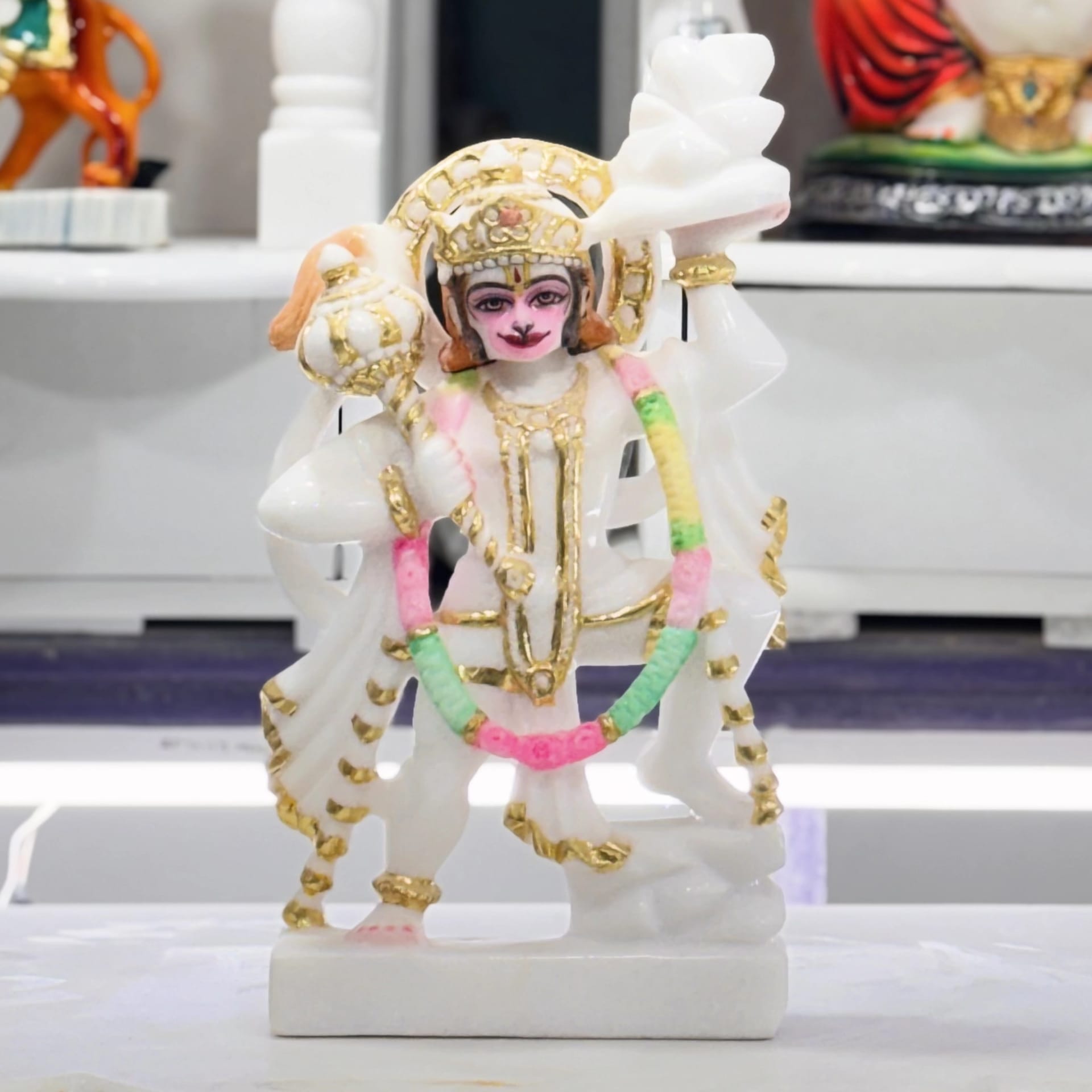 Hanuman murti in white Italian marble, standing with hands folded