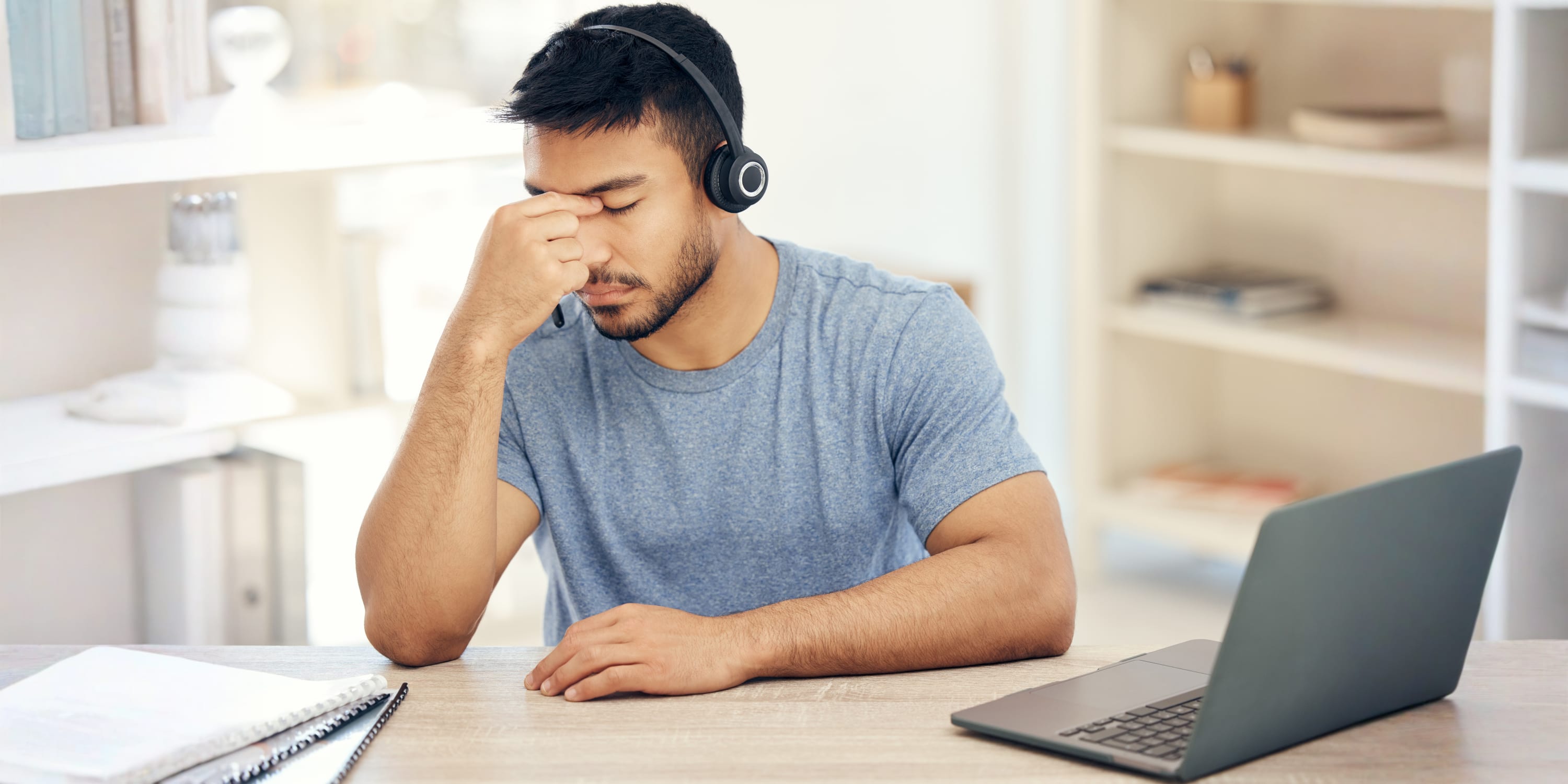 Stressed young professional struggling with interview anxiety during an online video interview