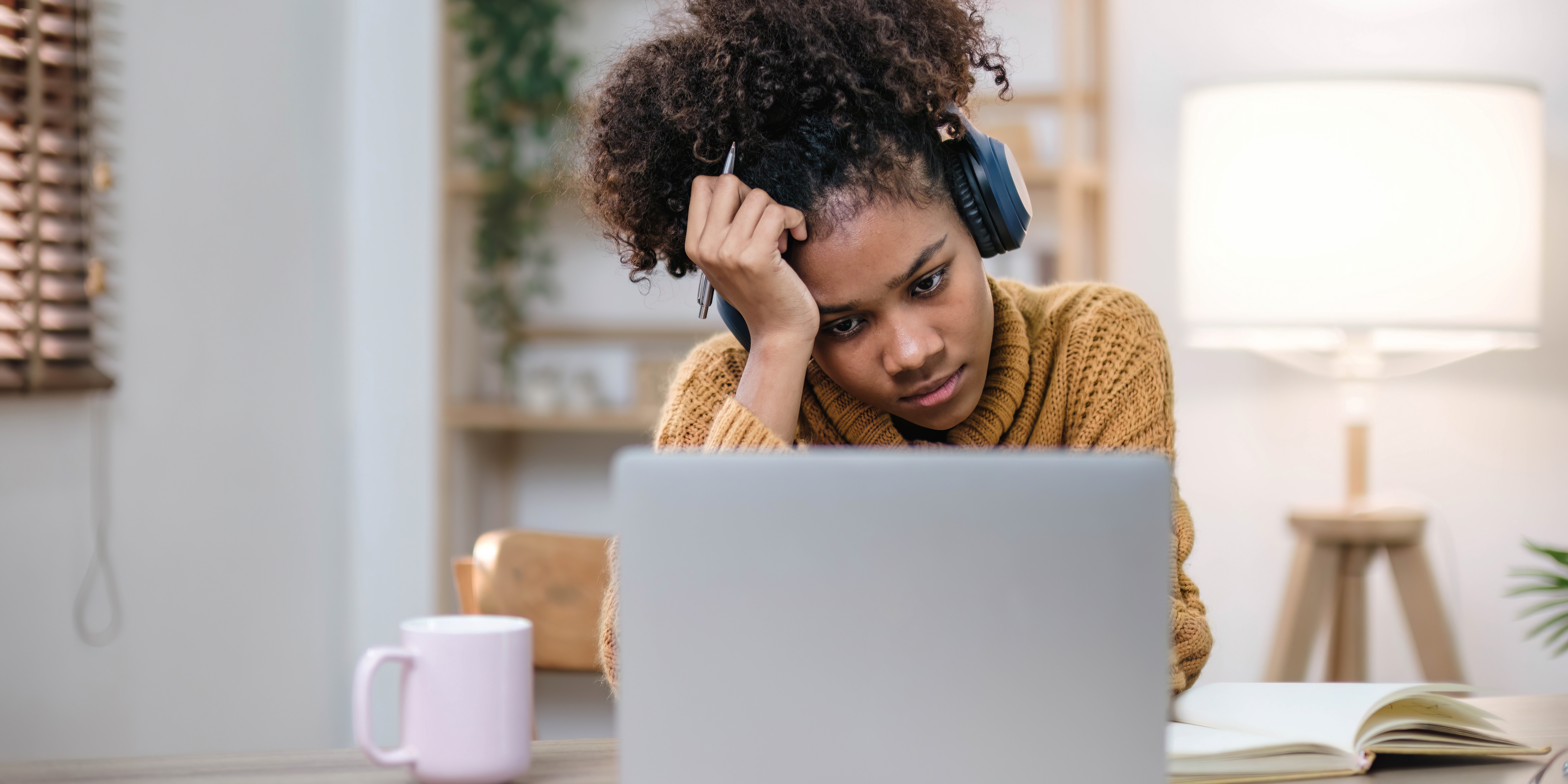 candidate experiencing interview anxiety during virtual job interview on laptop