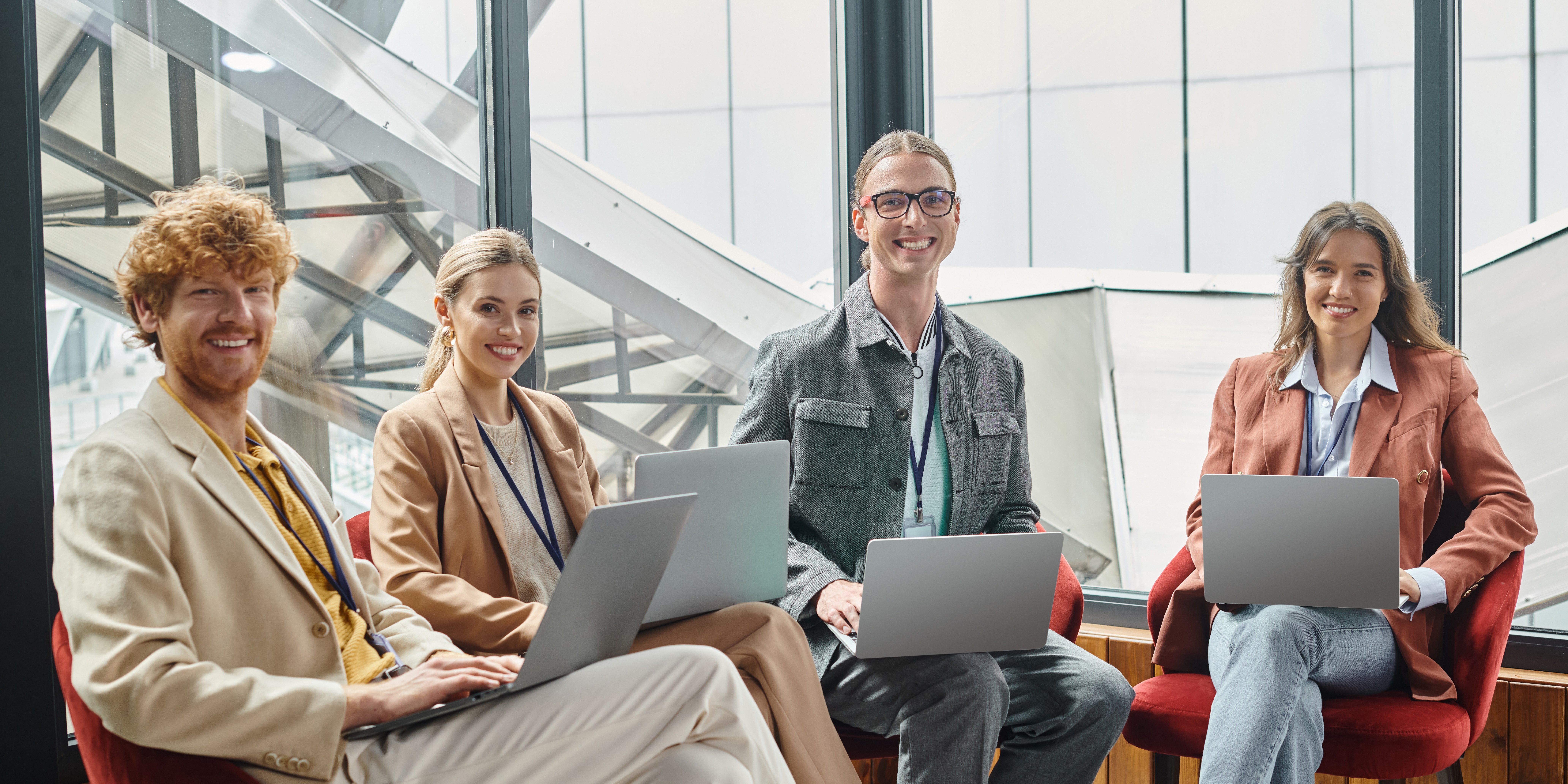 A team of confident, successful tech professionals smiling after a successful MockWin AI interview preparation