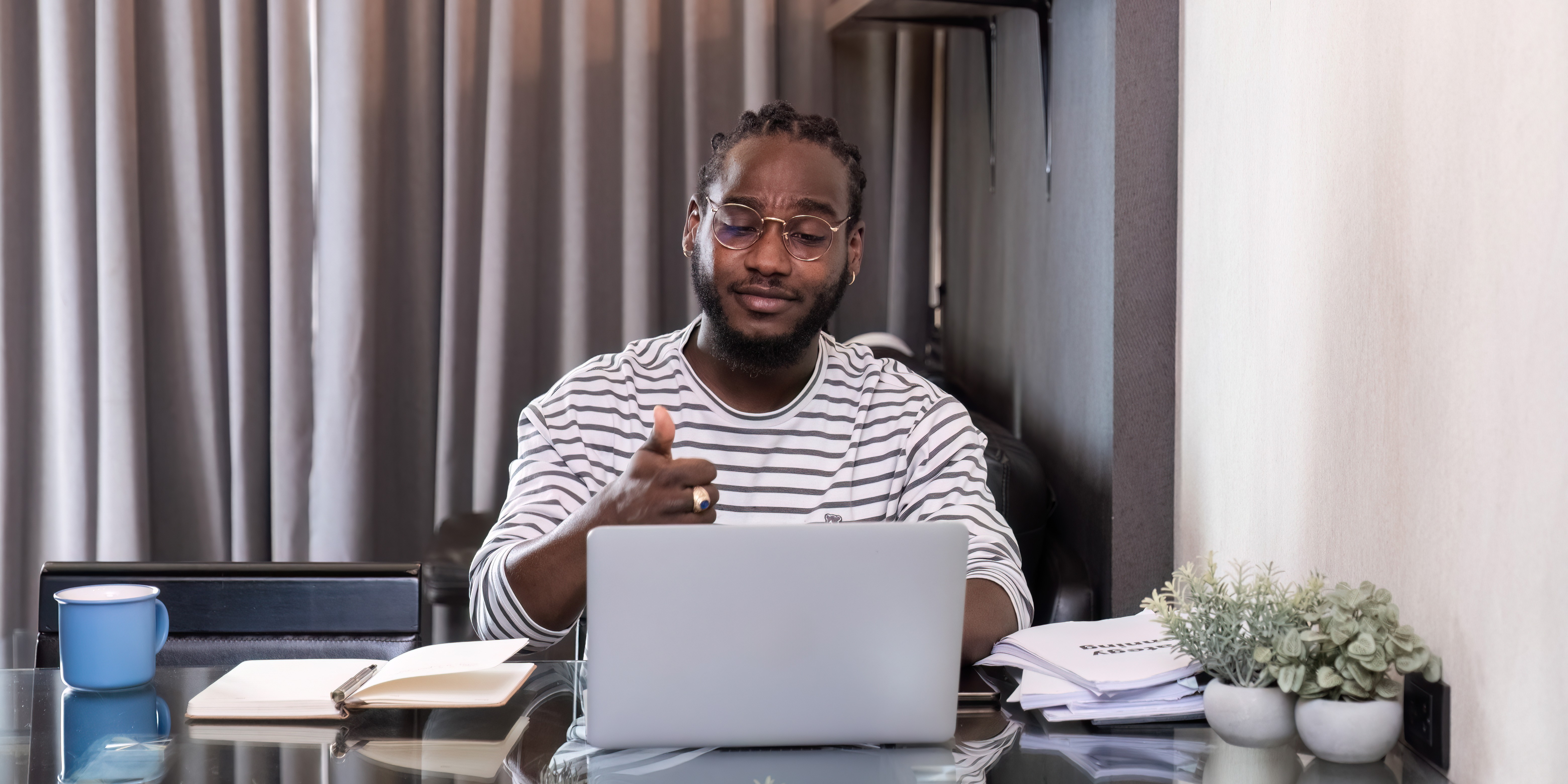 A professional candidate on a video call mock interview, confident posture and direct eye contact with camera