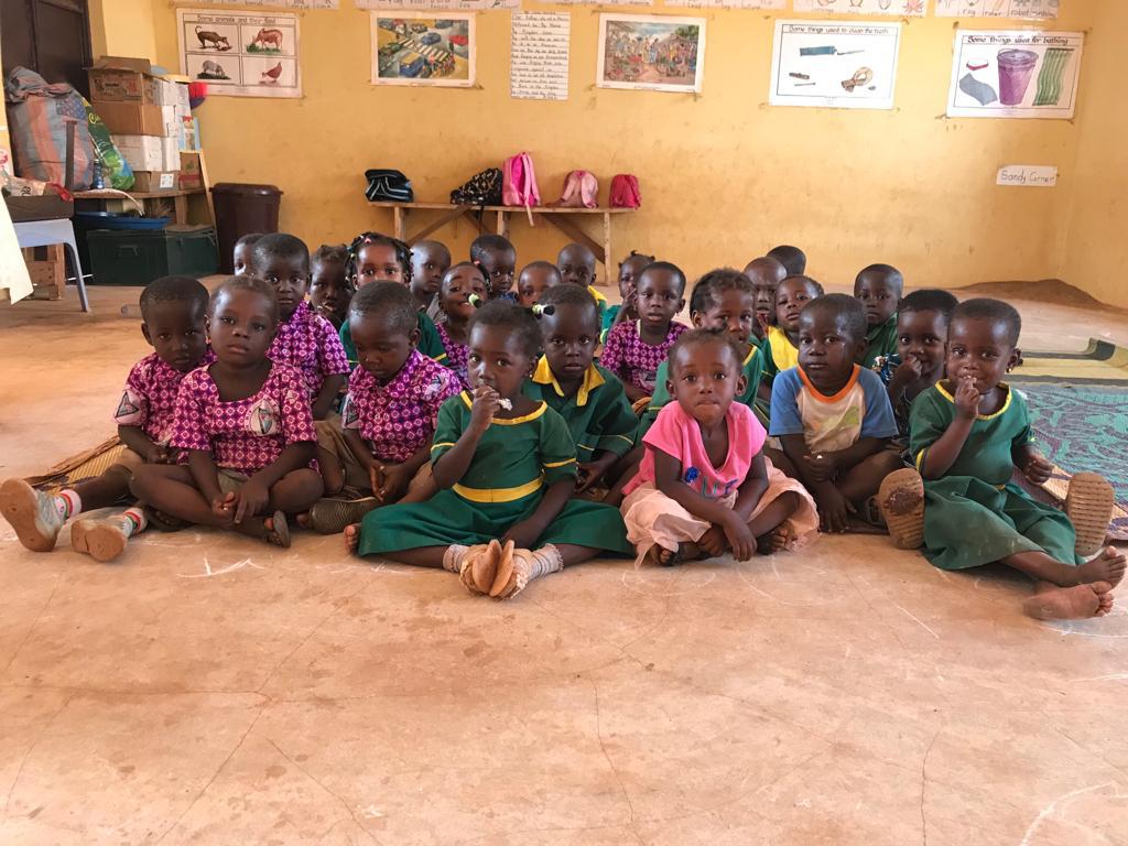 Image of Children sitting on classroom floor