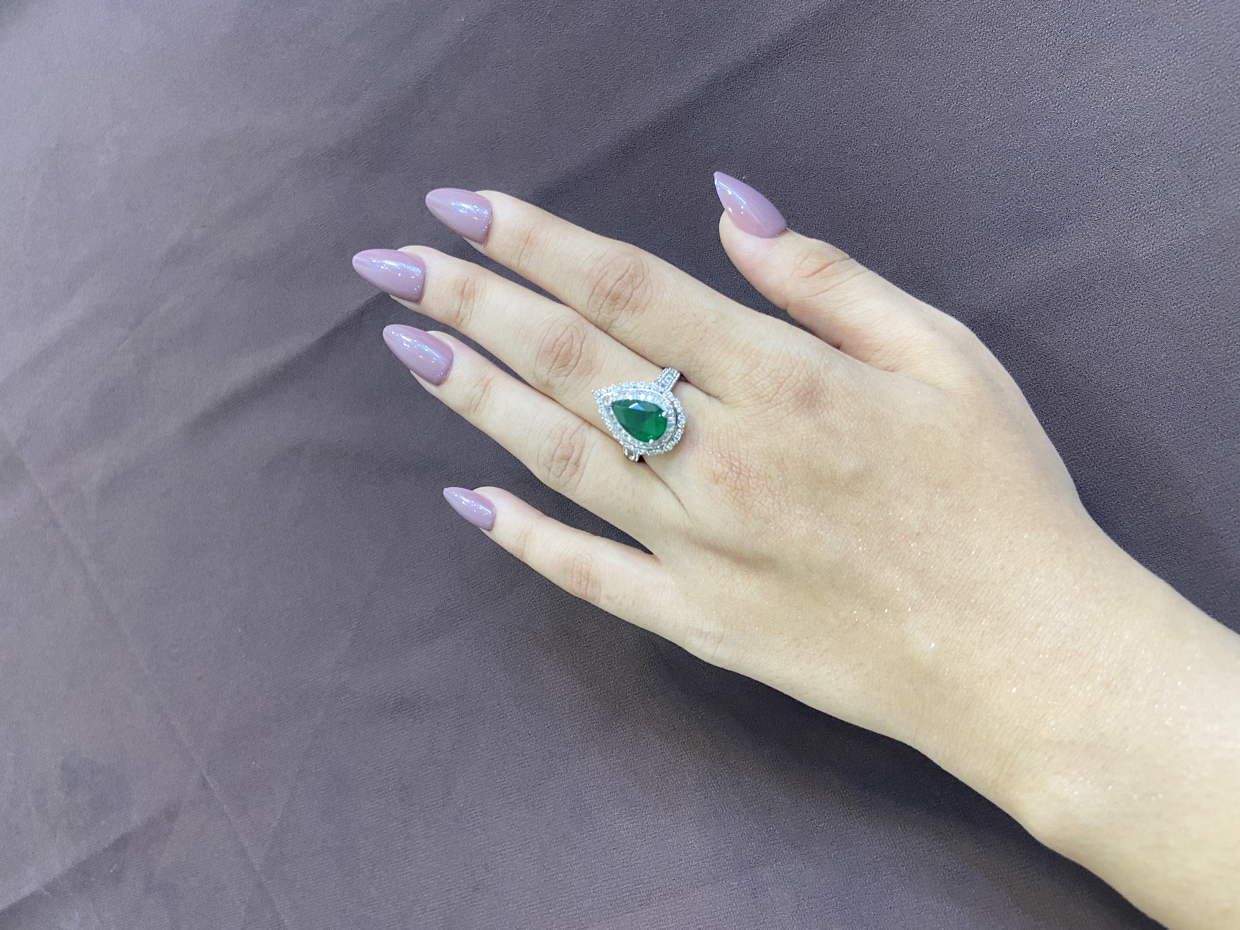PEAR EMERALD STONE WITH DIAMOND BORDER RING