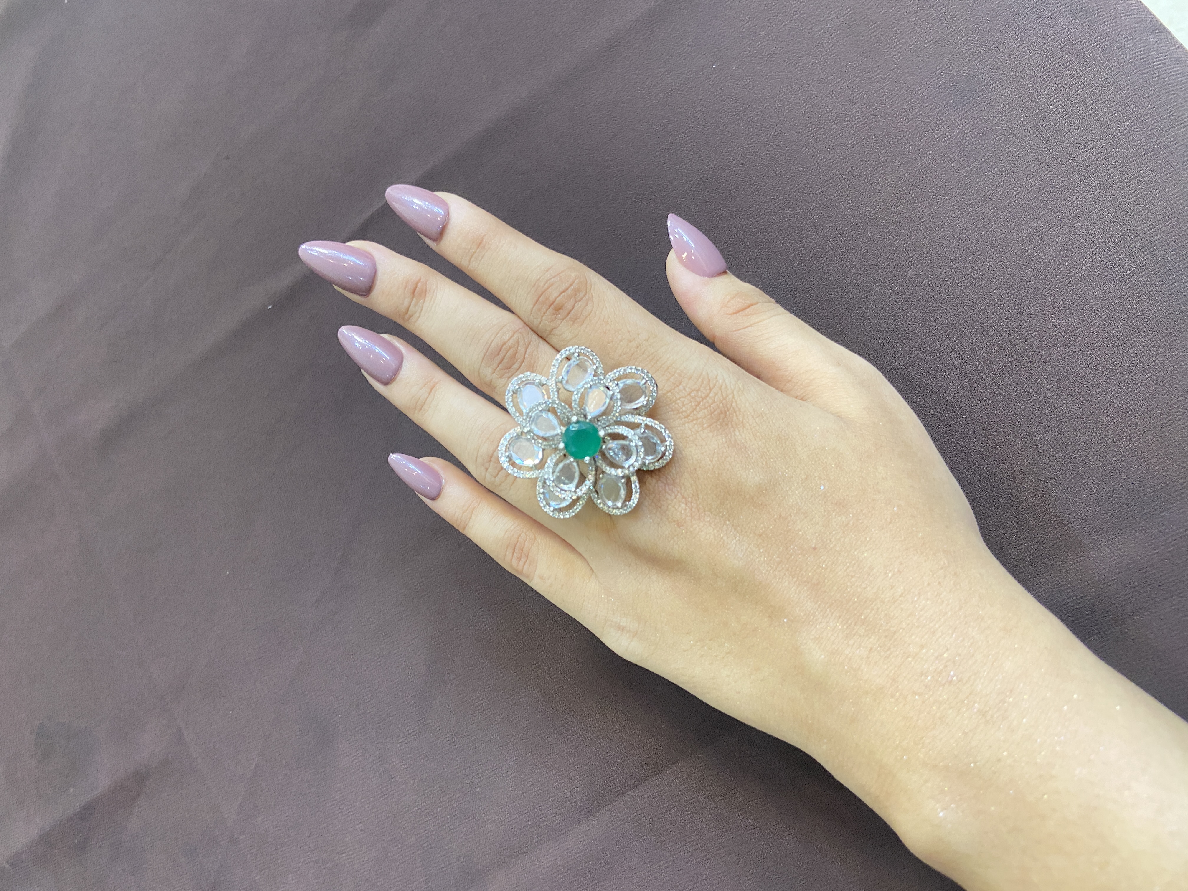 EMERALD STONE WITH TRANSPARENT DIAMONDS RING