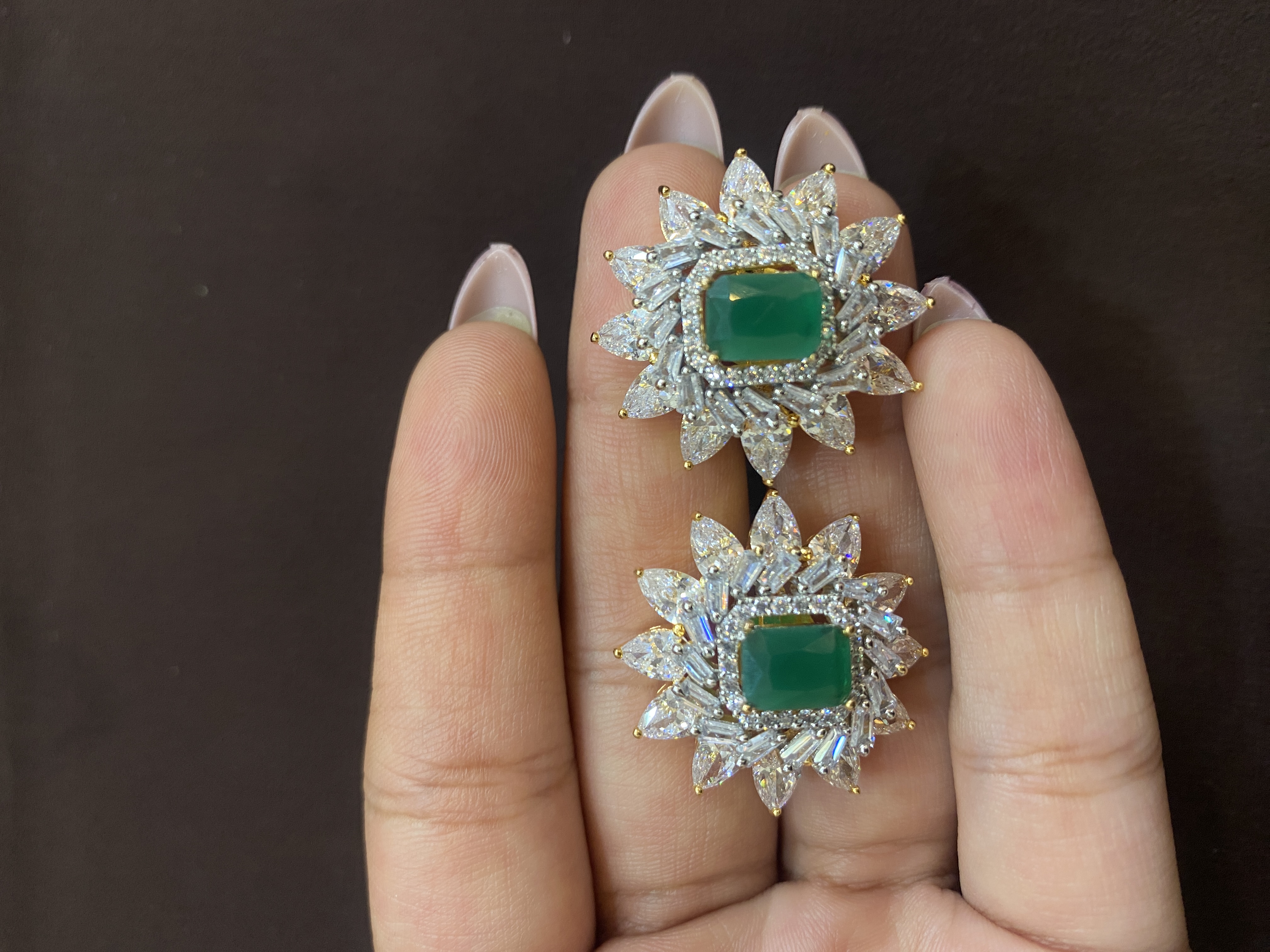 FLORAL DESIGN WITH GREEN STONE TOPS