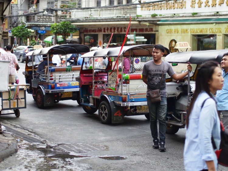 A street in Bangkok with Tuk Tuk drivers
