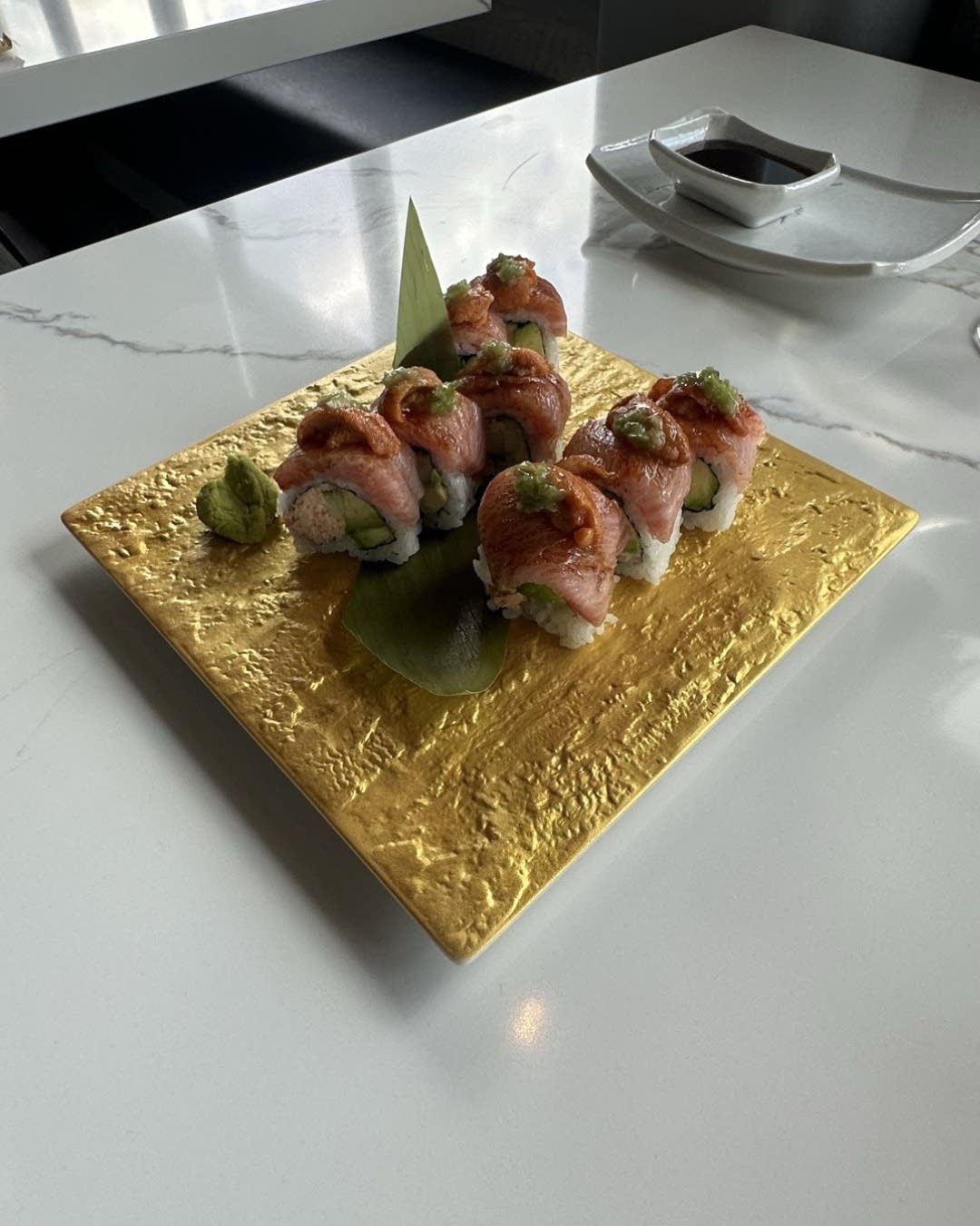 Castle Rock Roll on gold textured plate at Izumi Sushi in downtown Castle Rock