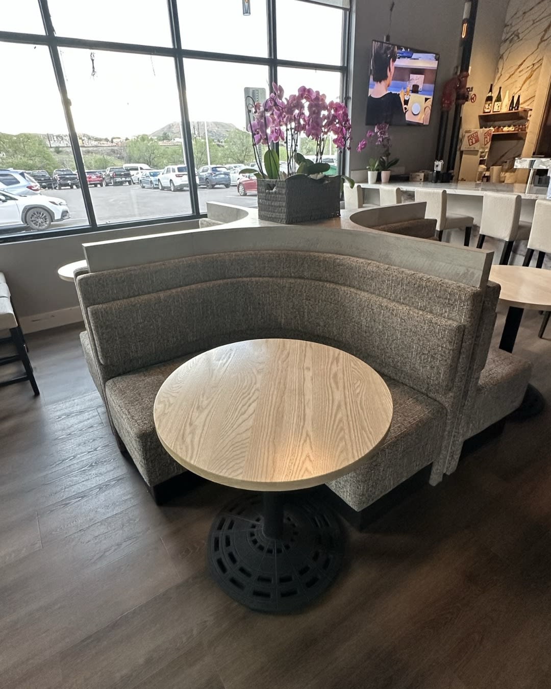 Izumi Sushi entry 2-top with curved booth and window view